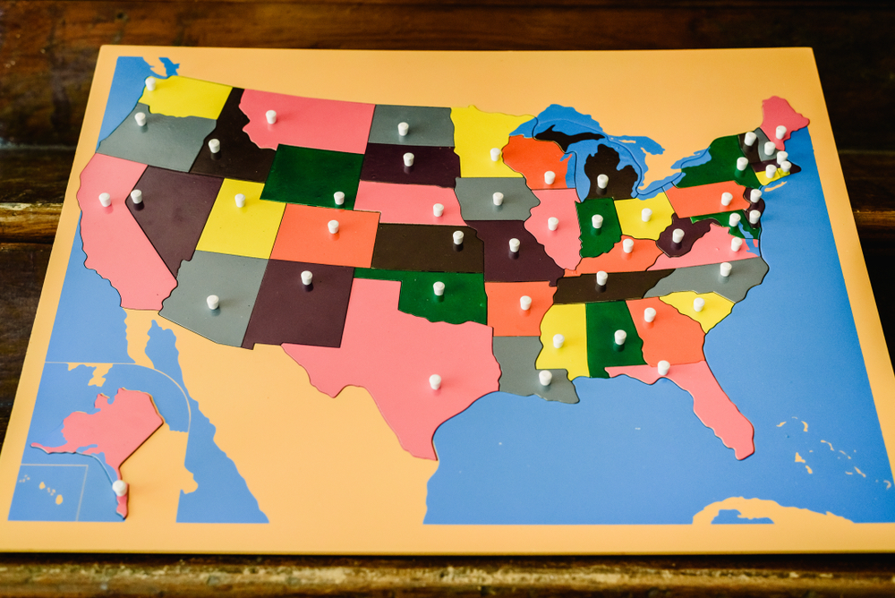 Photo of a puzzle map of the United States, symbolizing the potential for fragmented oversight if responsibilities shift to states.
